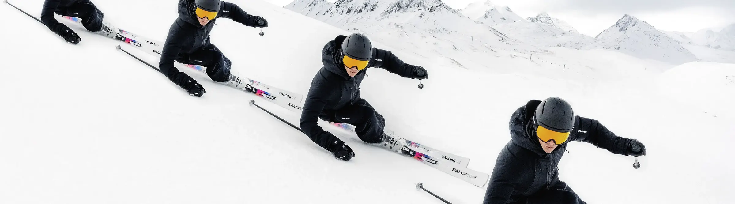 Skiers carving on snow (official Salomon photo)